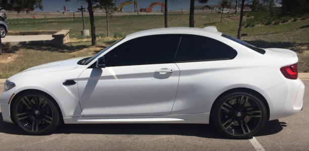 white sports car with tinted windows